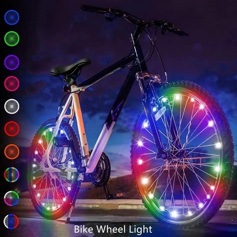 Waterproof LED light strip attached to bicycle wheel spokes glowing at night