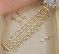 Golden brass layered necklace set with pearl accents for an elegant look