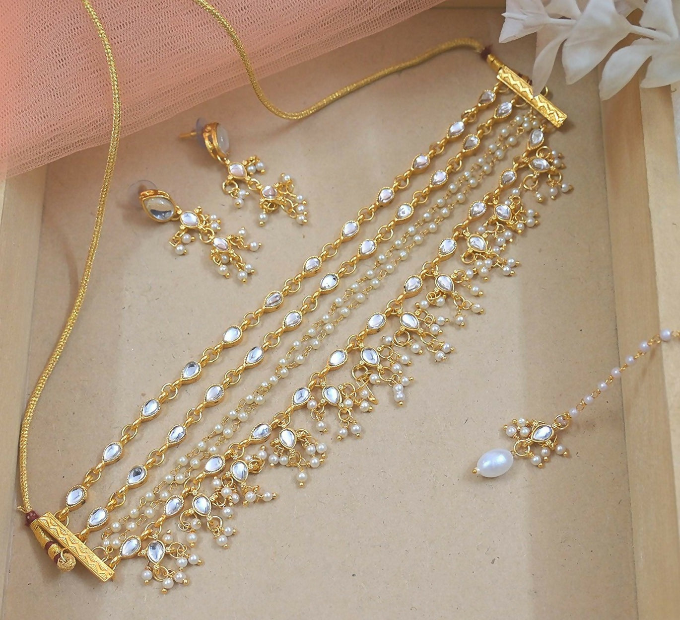 Golden brass layered necklace set with pearl accents for an elegant look