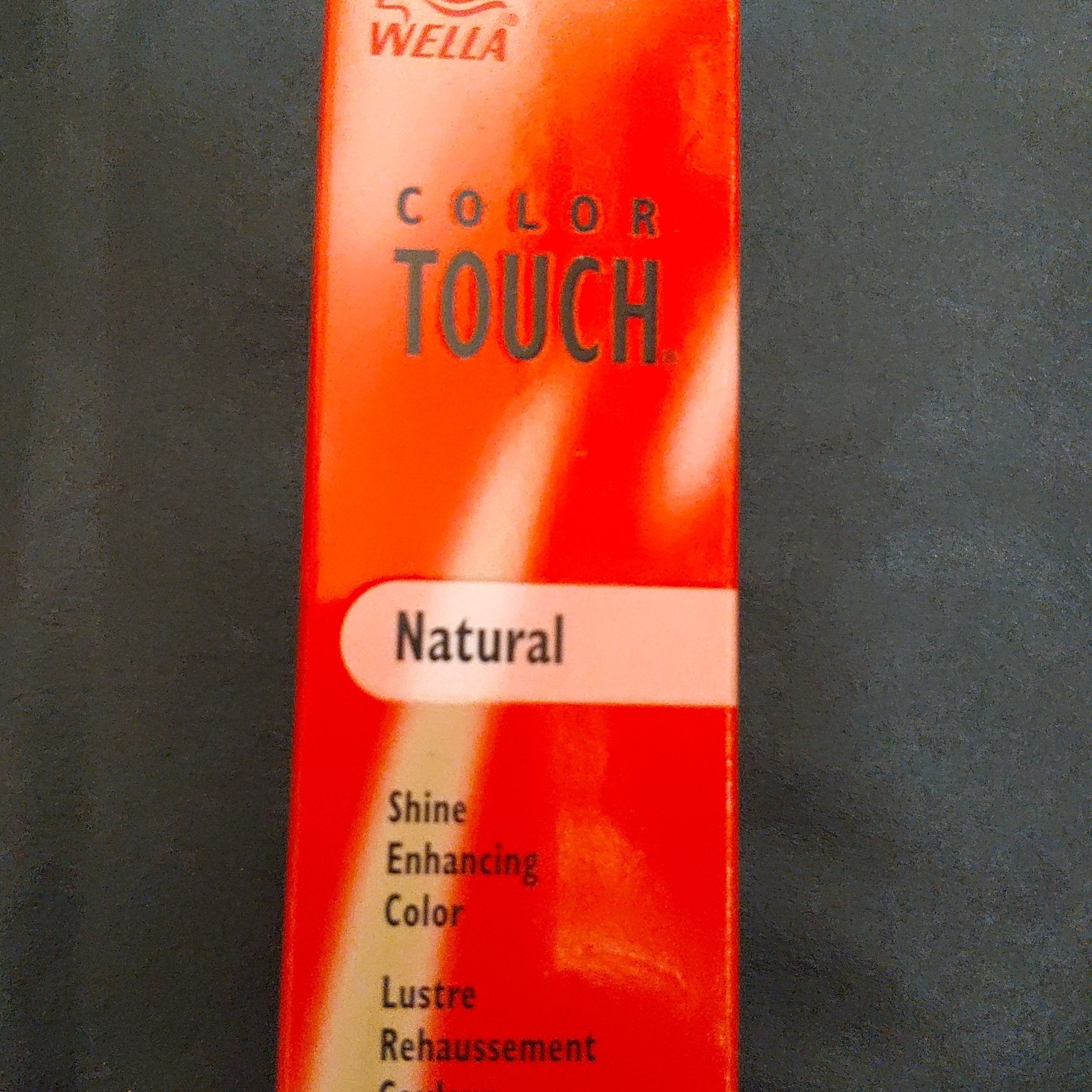 Wella Color Touch 6/35 Sand hair color bottle on a clean background