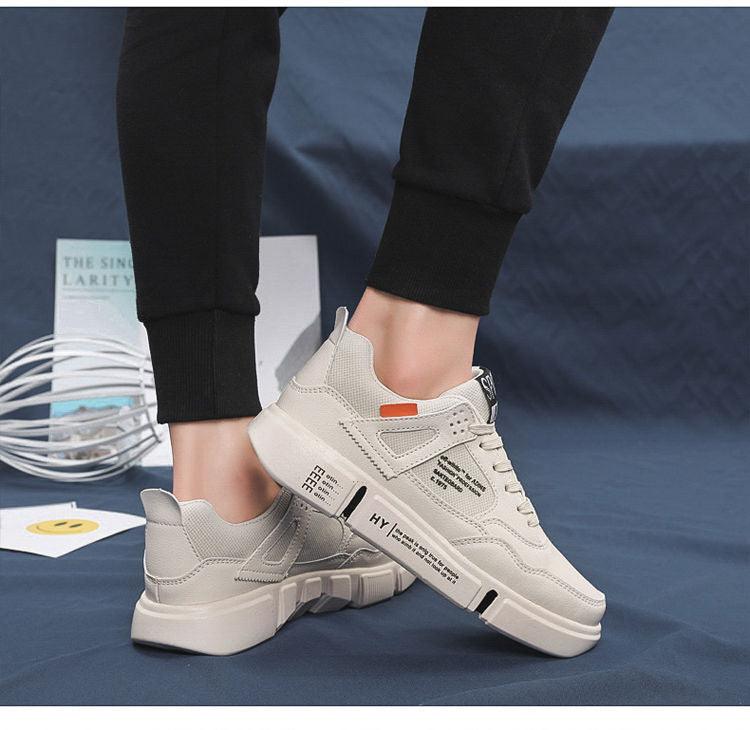 Pair of men's white leather casual walking sneakers