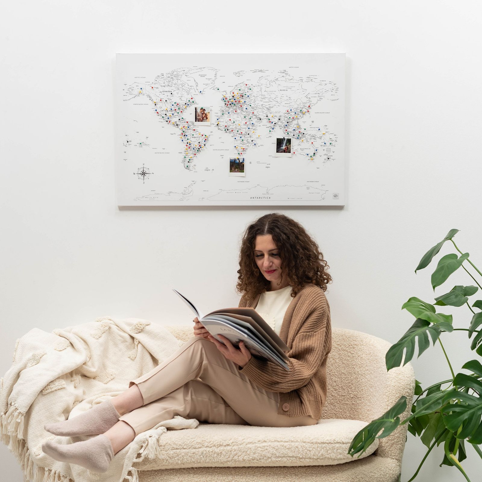 Detailed world map printed on white canvas hanging as wall art