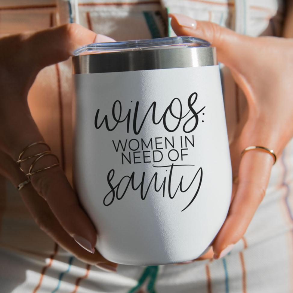 A white 12oz stainless steel wine tumbler with the quote Winos: Women In Need Of Sanity printed in black script.