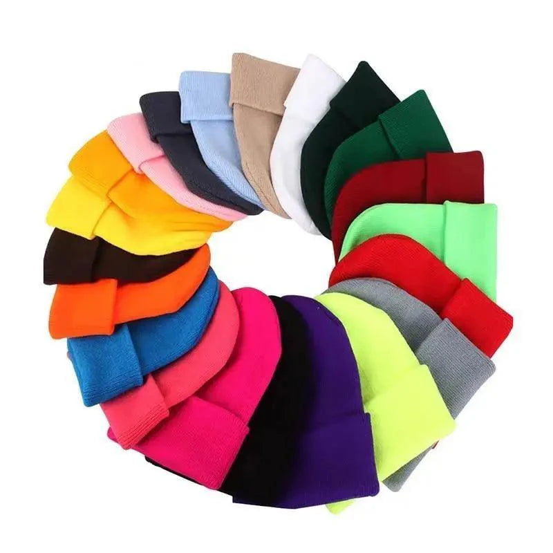 A soft knit, stretchy winter beanie hat in a solid color, perfect for casual cold-weather outfits.