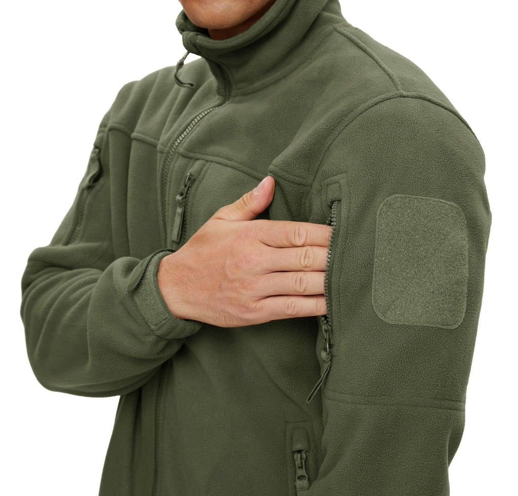 Men's tactical winter fleece jacket with multiple utility pockets in dark outdoor setting