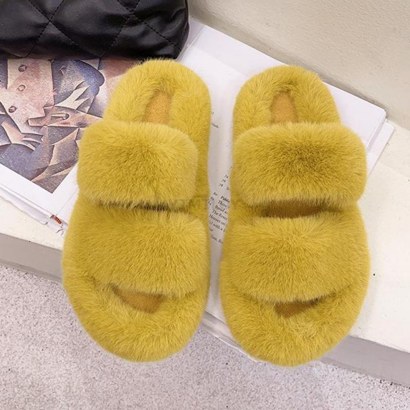 Women wearing cozy yellow faux fur cross band open toe house slippers