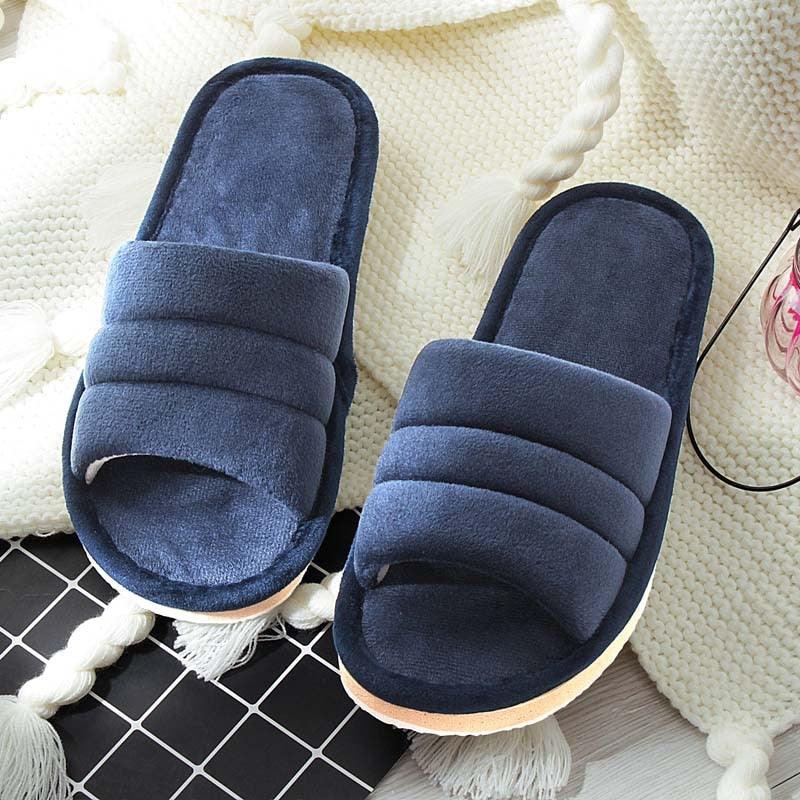 Women's plush navy blue memory foam slippers with anti-skid sole, minimalist indoor design.