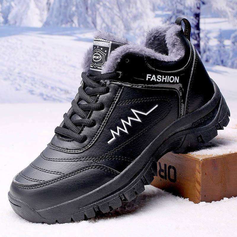 A pair of durable, waterproof leather winter snow boots with plush lining and rugged lug soles for outdoor hiking.