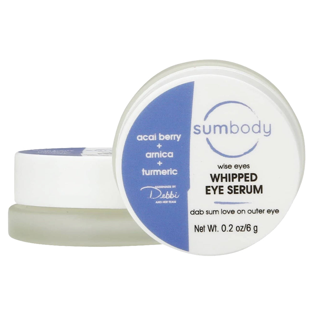 Wise Eyes Whipped Eye Serum container open showing product texture with ingredient labels