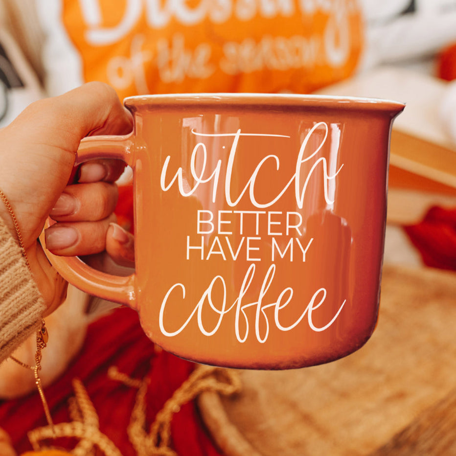 Orange ceramic mug with white text saying Witch Better Have My Coffee
