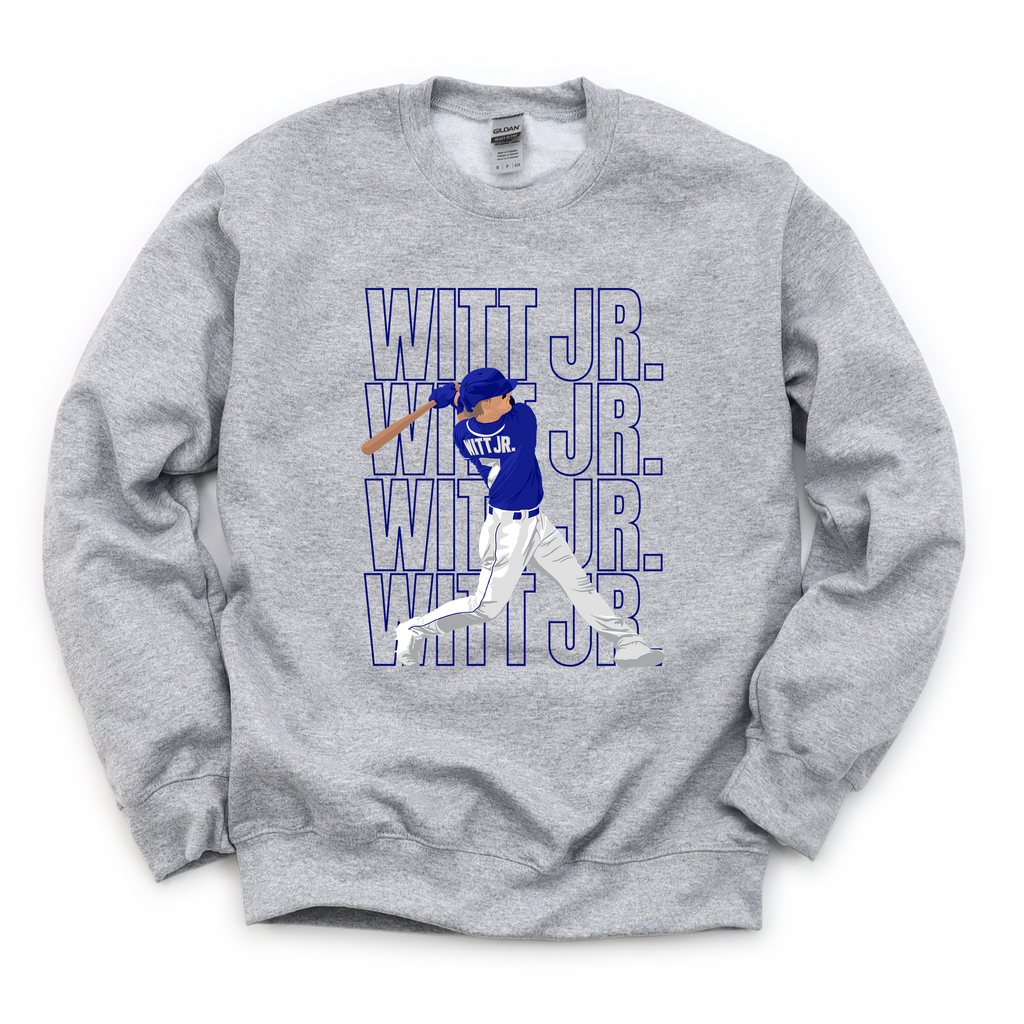 A person wearing a grey athletic heather t-shirt featuring a repetitive blue and white graphic design of a baseball player at bat with the text Witt Jr.