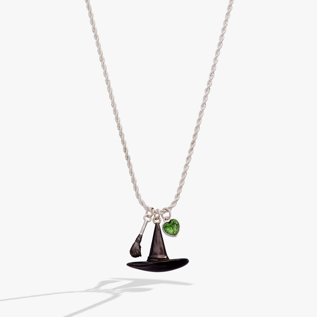 The Wizard of Oz themed pendant featuring a rope chain, erinite heart stone, broomstick, and Wicked Witch hat.