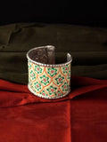 A beautiful hand-painted silver-plated brass kada bracelet with intricate oxidised detailing.