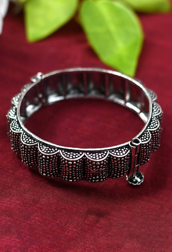 Oxidised silver-toned bangle set with traditional patterns