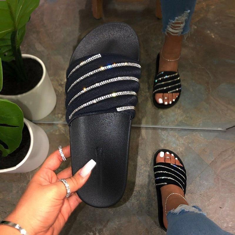 Women's comfortable slide sandals with rhinestone detailing for beach and casual summer wear.