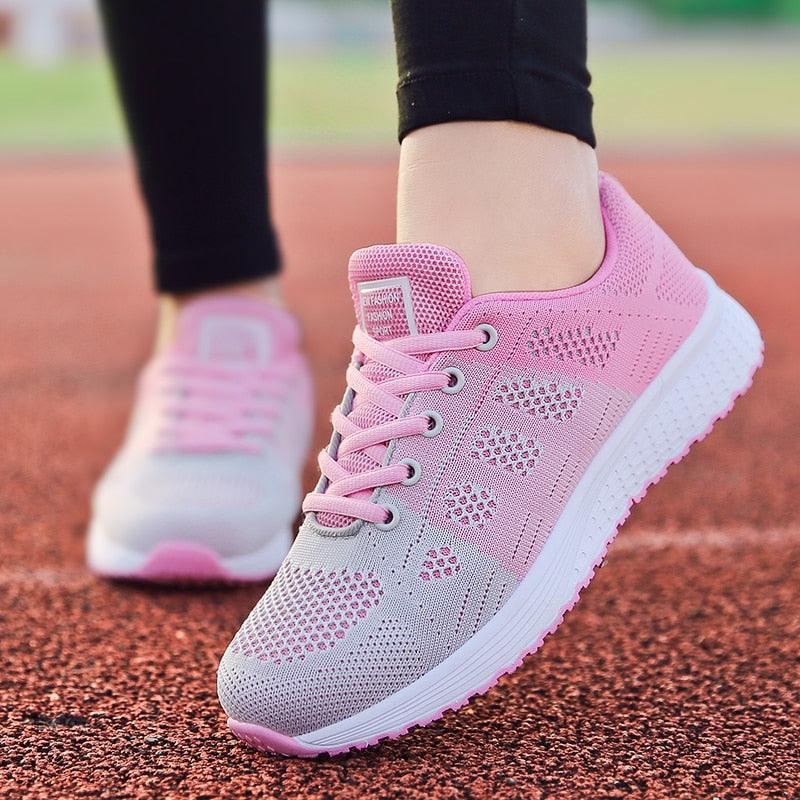 Women's breathable mesh lace-up walking sneakers in a casual, lightweight athletic design.