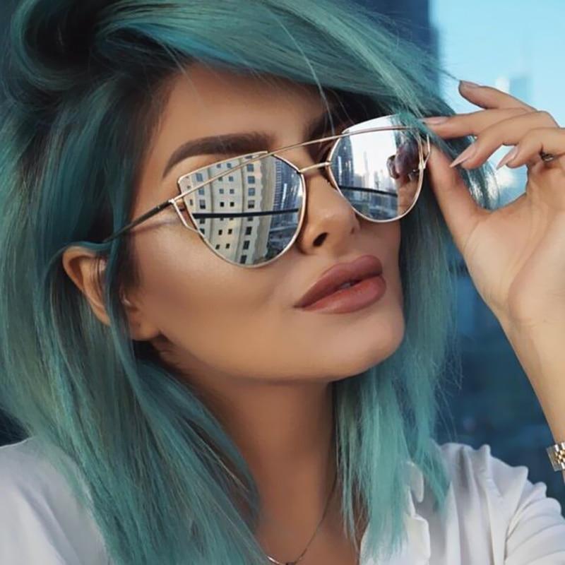Rose gold metal cat eye sunglasses with reflective mirror lenses