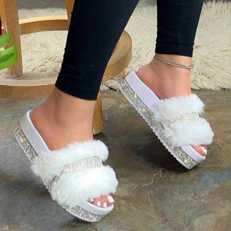 Women's glitter-finished fluffy fur slides with open-toe design in white and pink.