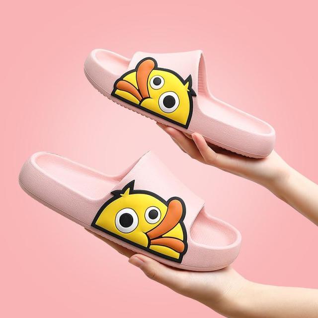 Cute duck design platform slides in various colors including pink and yellow on a beach background.