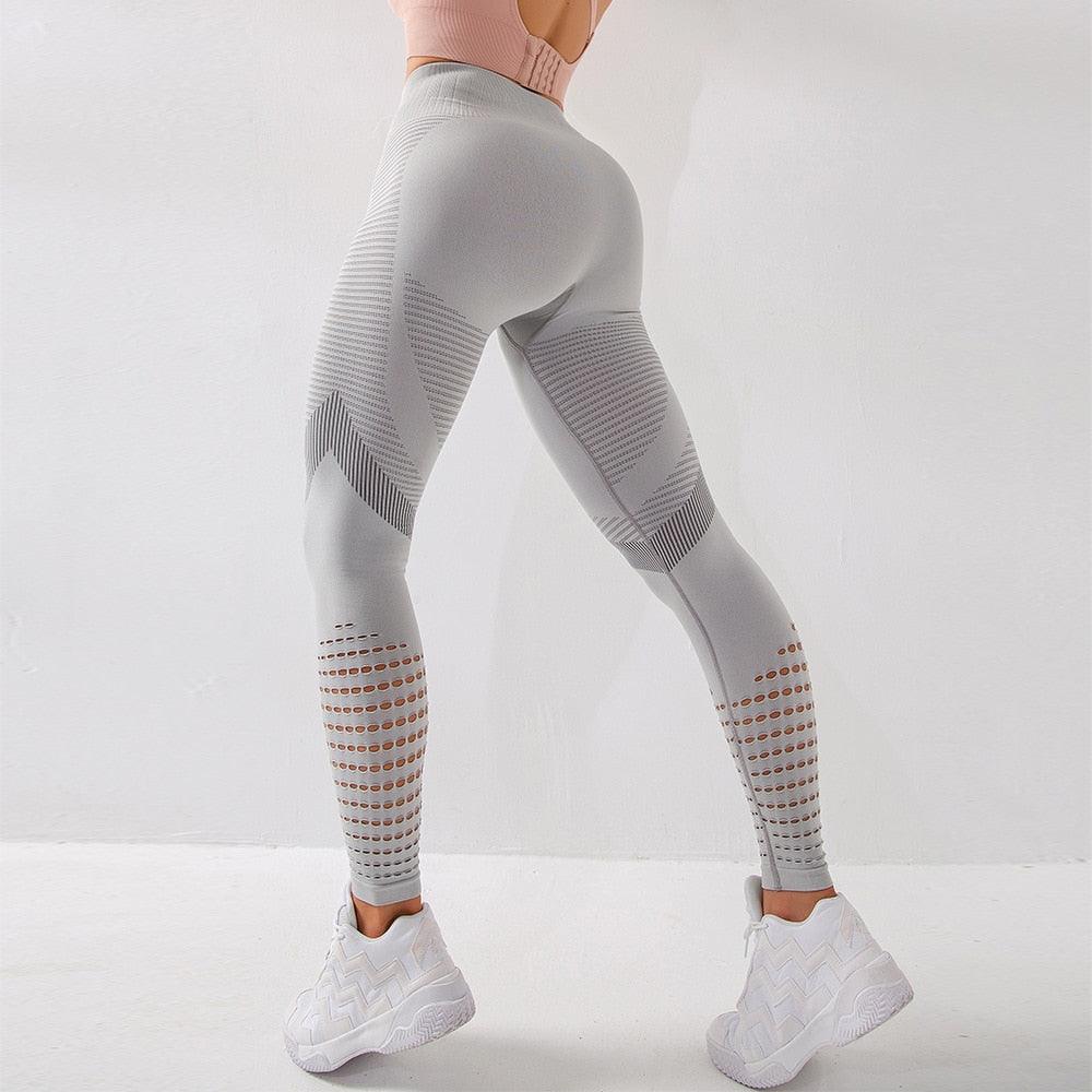 Model wearing high-waisted seamless fitness leggings with stylish mesh ventilation panels