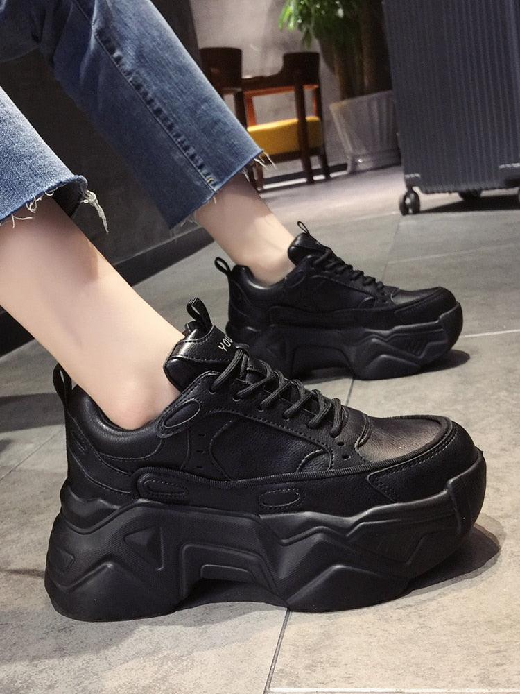 Black chunky leather platform sneakers for women with lace-up closure