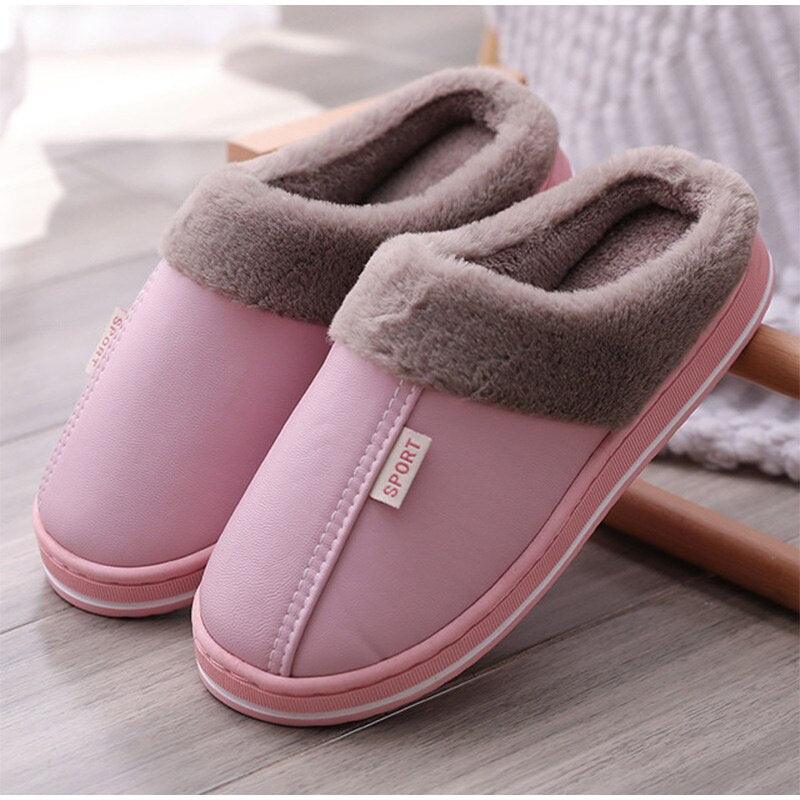 A pair of plush memory foam house slippers with non-slip soles