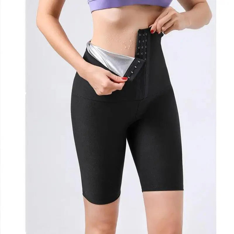 Woman wearing high-waisted black thermo compression sauna pants for weight loss and workout support.