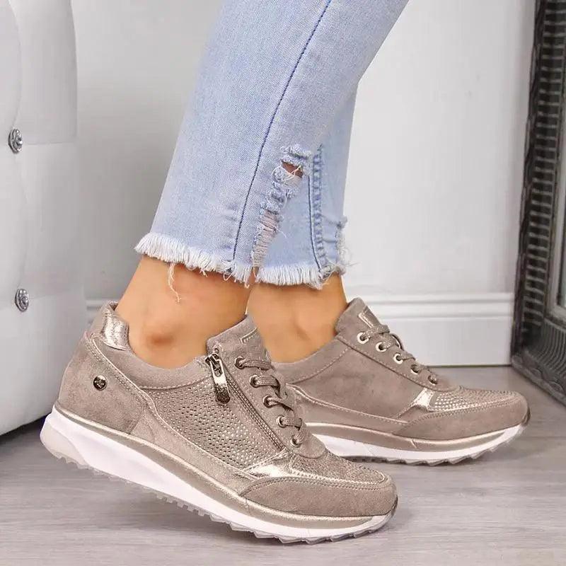 Modern women's streetwear sneakers with an elastic platform sole in neutral and metallic colors.