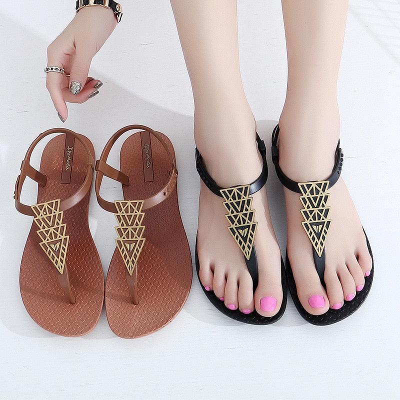Women's T-strap flat sandals with cutout detail in a casual summer beach style