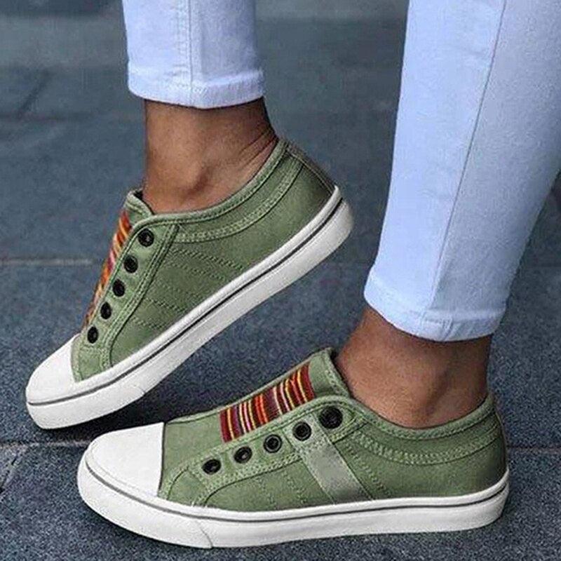 Women's low-cut canvas slip-on sneakers with elastic band detail and pre-distressed fabric finish