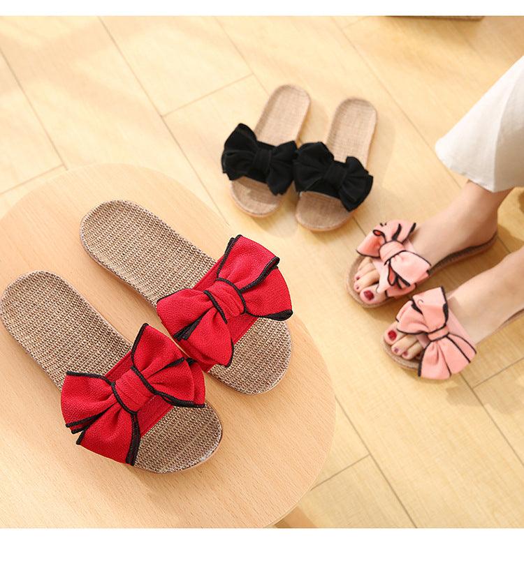 Women's linen platform slides with striped bow detail in red, black, pink, and beige
