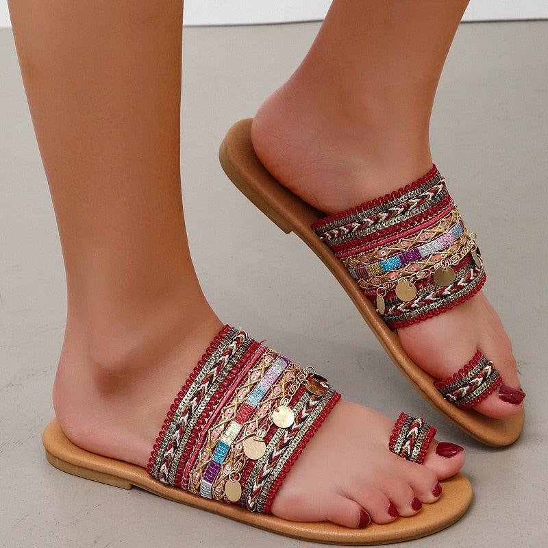 Women's bohemian style strappy geometric pattern sandals for beach and summer wear.
