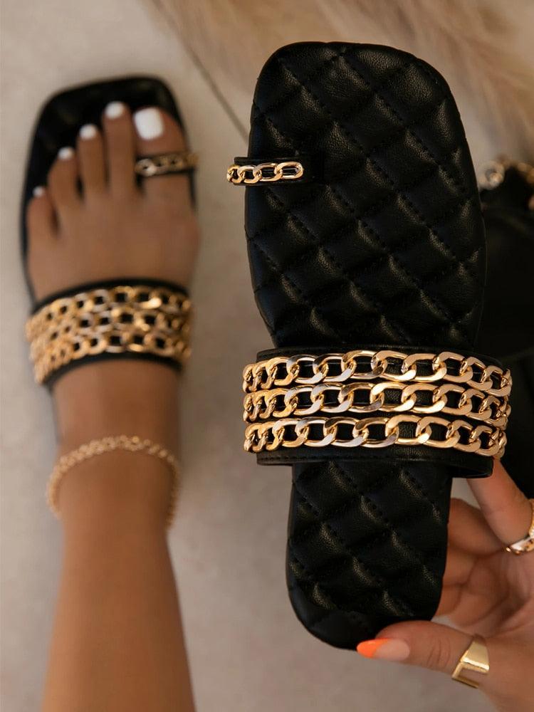 Women's summer weave slide sandals featuring a decorative gold chain and elastic slingback design.