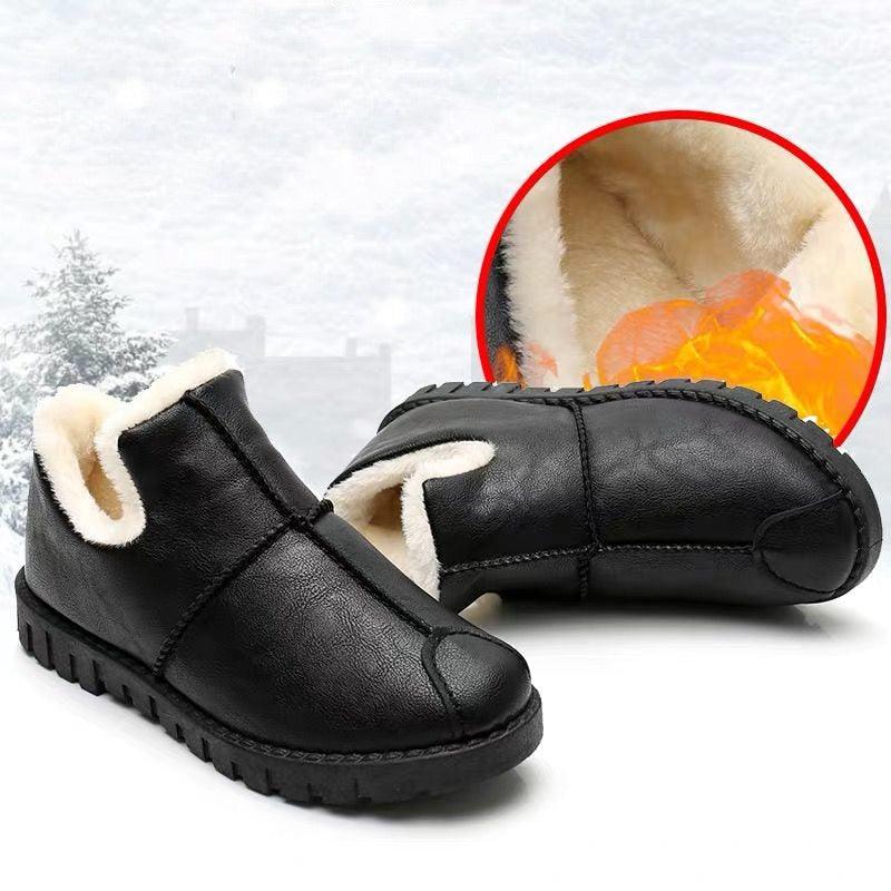 Black waterproof winter booties with plush lining, platform sole, and lace-up closure