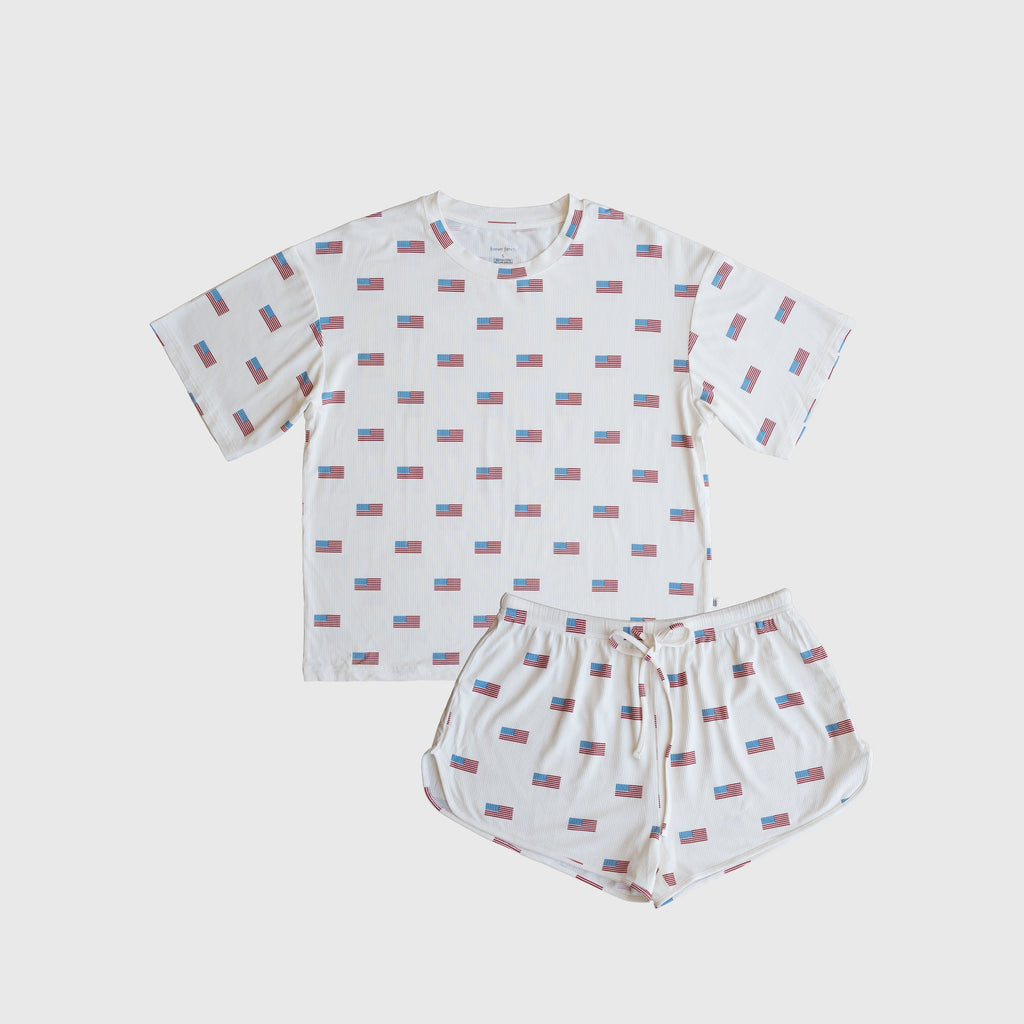 Women wearing a ribbed bamboo short set in Americana red, white, and blue colors featuring an oversized tee and drawstring shorts.