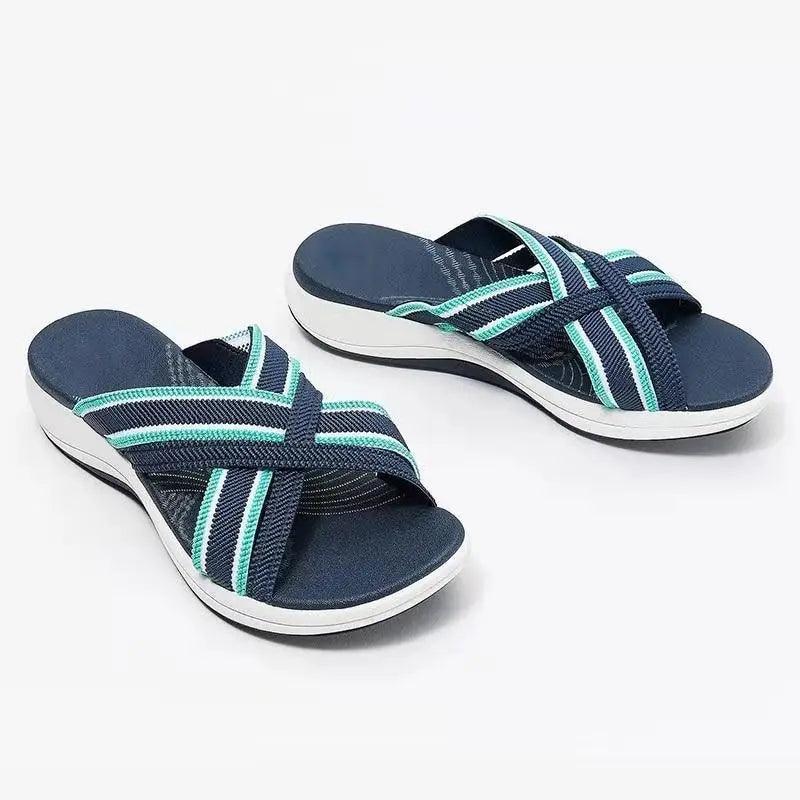 Women's minimalist flat summer sandals in various colors displayed on a neutral background.