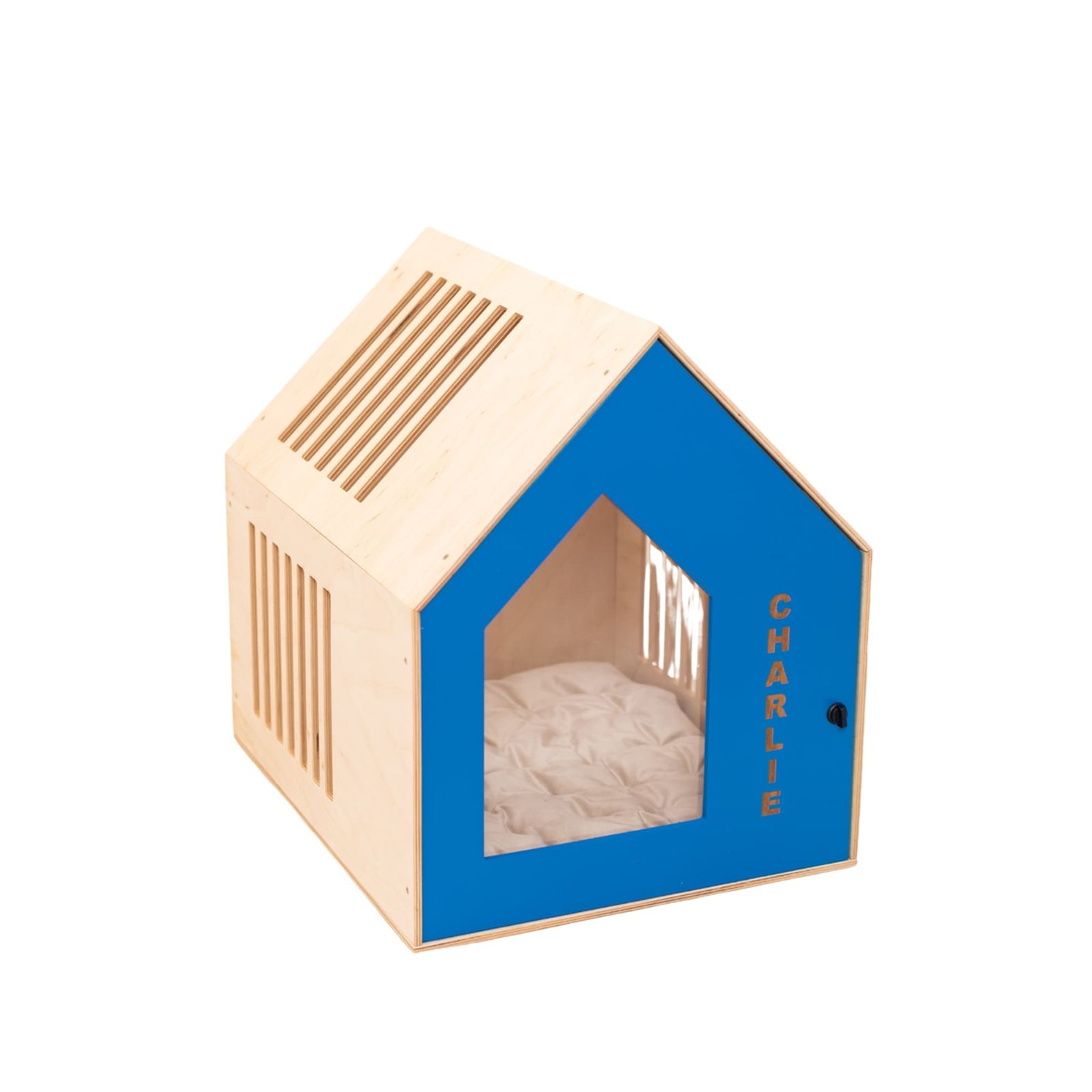 A vibrant blue booth-style wooden dog house with a cozy interior design
