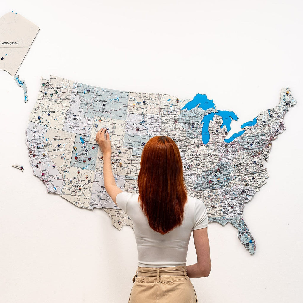 Wooden USA wall map with beige and blue details on a neutral background