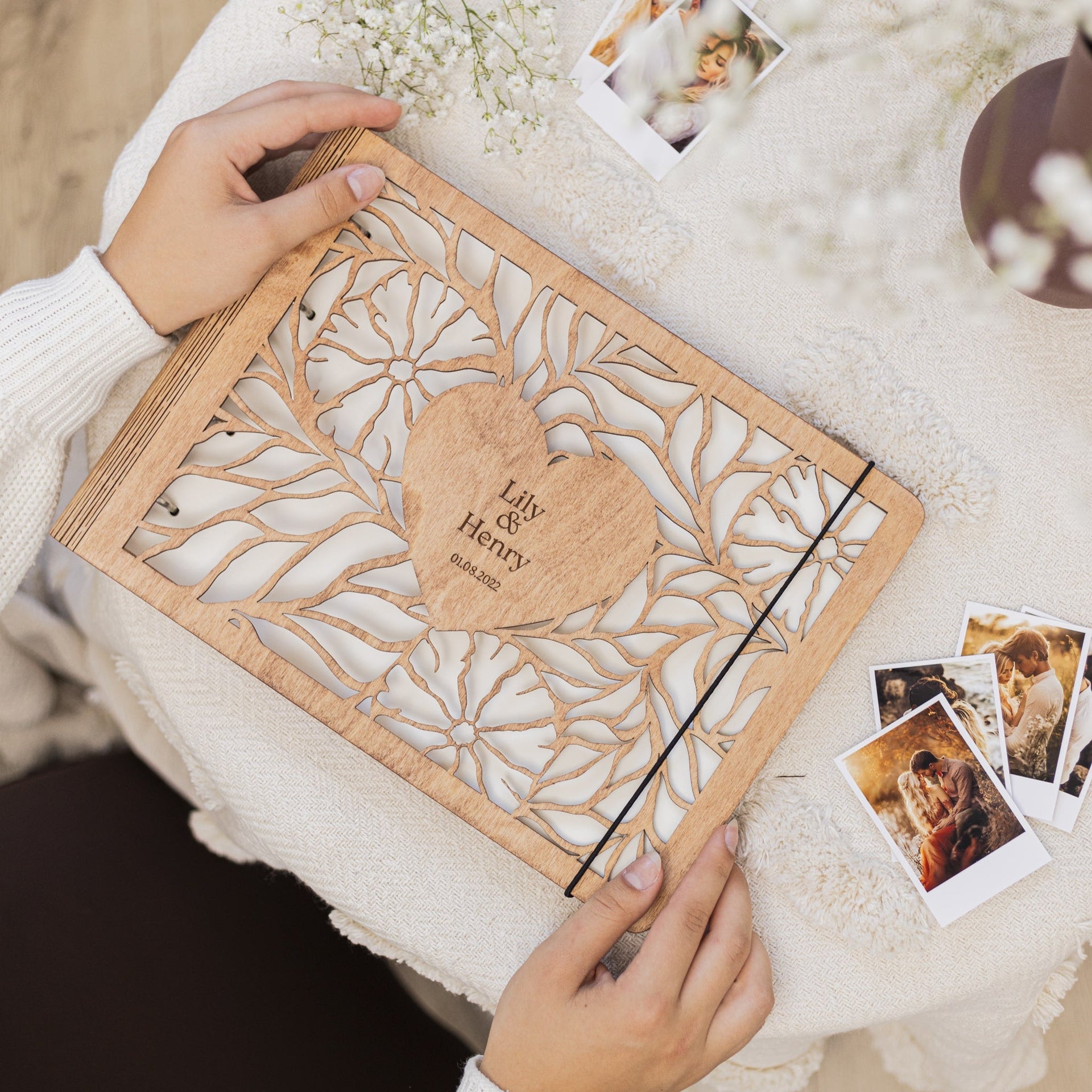 Bloomheart wooden photo album with floral heart design displayed on a neutral surface