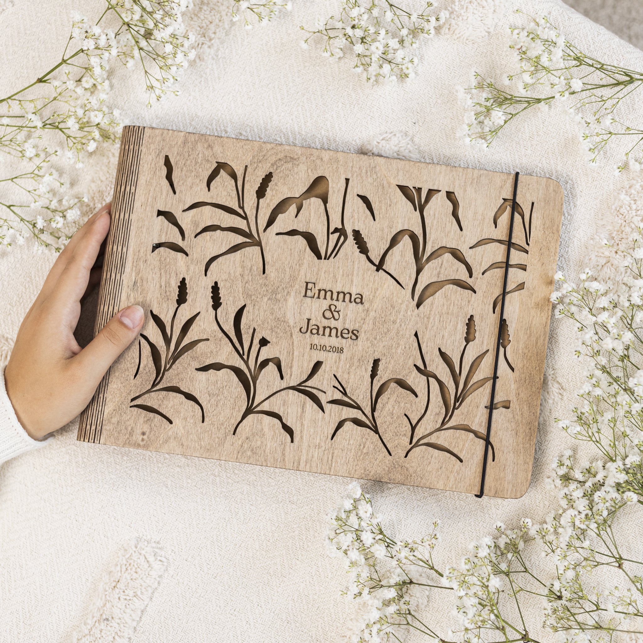 Meadow wooden photo album with detailed engraved grassland pattern on the front cover.