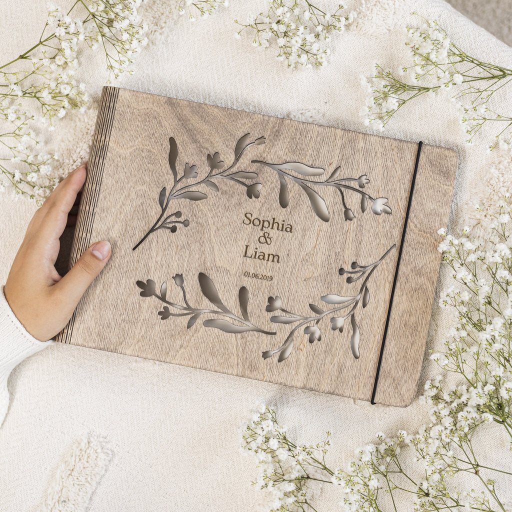 Close up of the Vine Wooden Photo Album showing intricate vine engraving on a natural wood surface