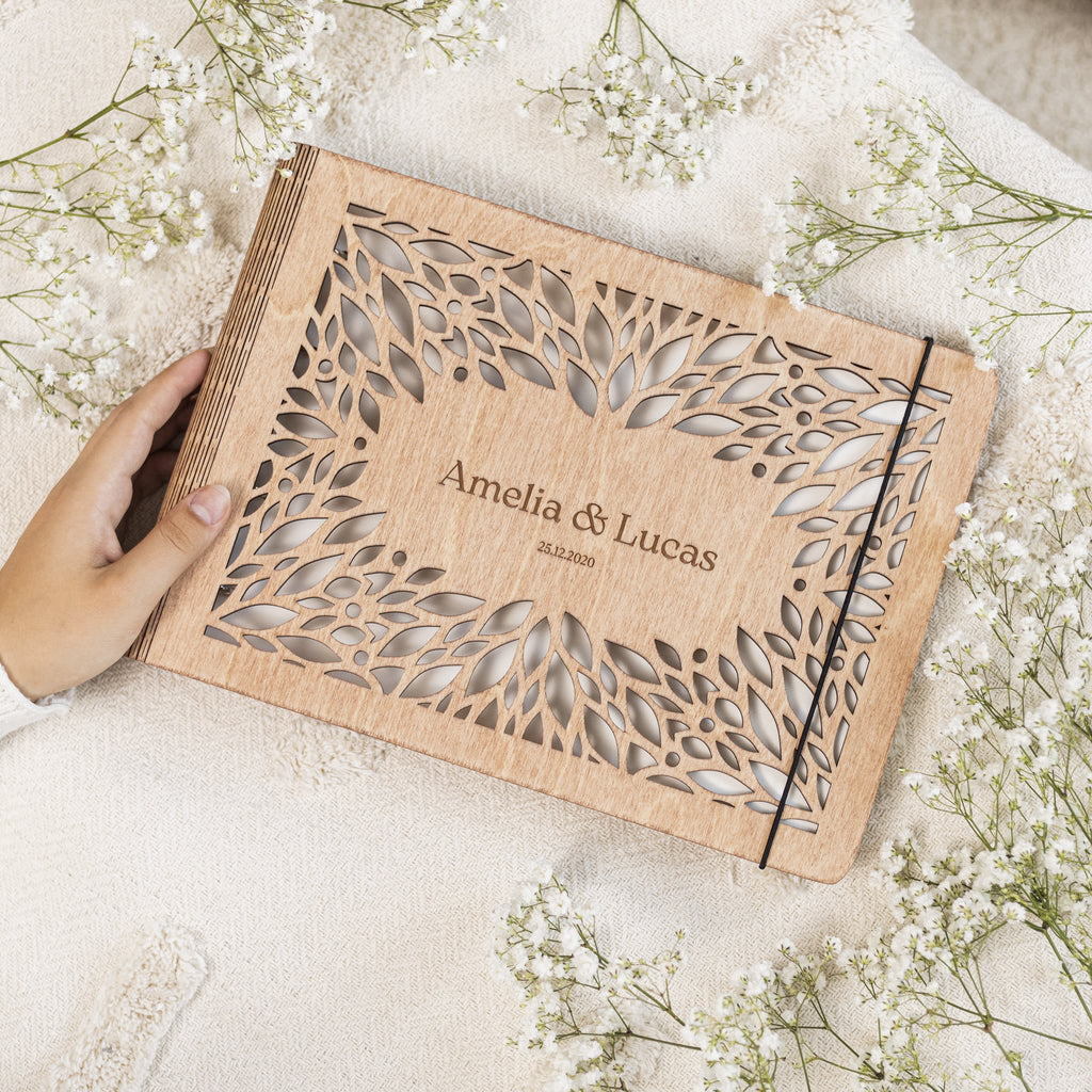 Close up of the Crownleaf wooden photo album with laser-engraved botanical leaf patterns.