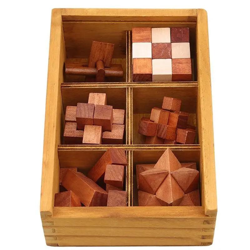 Brown and tan wooden interlocking brain teaser puzzle on a minimalist wooden surface.