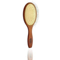A minimalist wooden round paddle brush with metallic gold-tone bristles on a clean, neutral surface.
