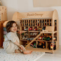 Minimalist wooden toy car garage organizer in a neutral room setting