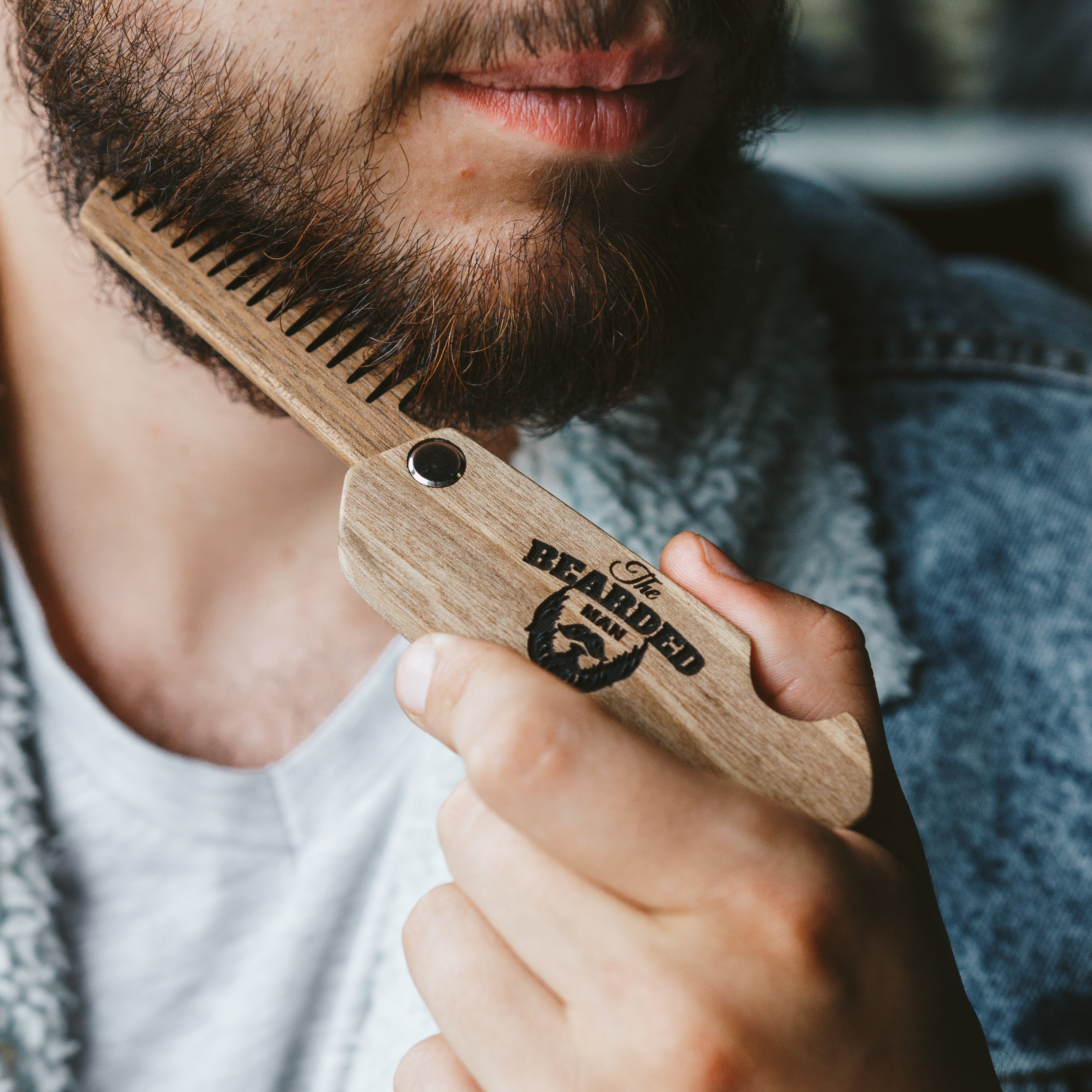 Premium walnut wooden beard comb with natural wood grain texture