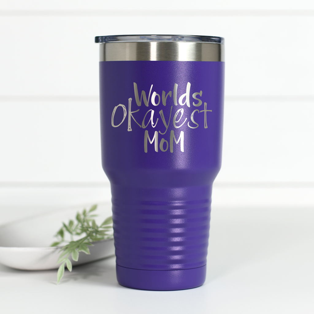 Purple 30 oz stainless steel tumbler engraved with the text World's Okayest Mom