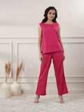 Model wearing a vibrant fuchsia sleeveless cotton yoga set with a boat neck, front view