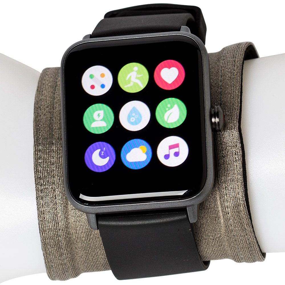 A grey EMF protection wrist band worn under a black smartwatch on a white mannequin wrist.