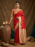 Elegant red soft silk saree with a contrast peach blouse for traditional occasions